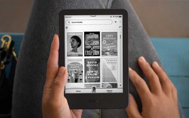  A person using the 2024 Amazon Kindle to read ebooks