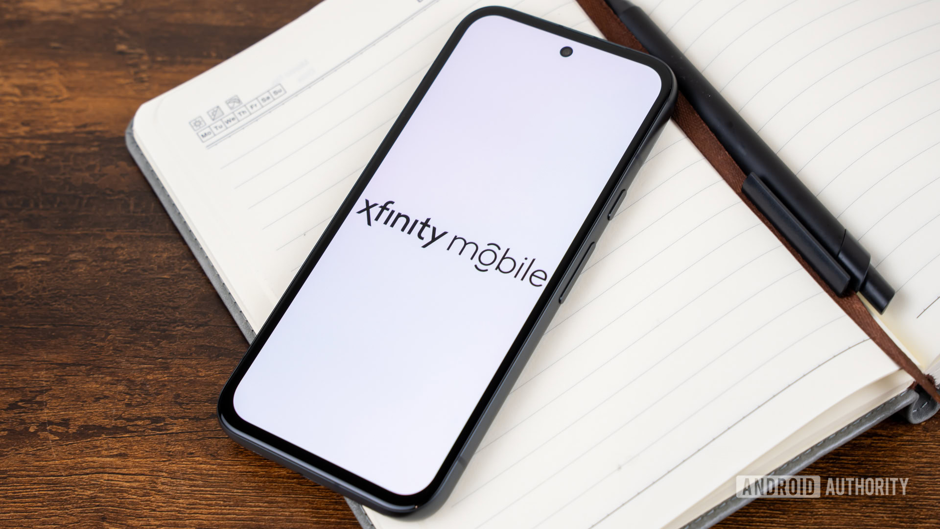 Λογότυπο Xfinity Mobile στο smartphone Στοκ Φωτογραφία (4)