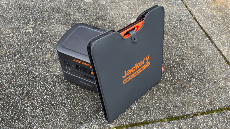  Jackery Explorer 3000 solar generator with its solar panels sitting on pavement