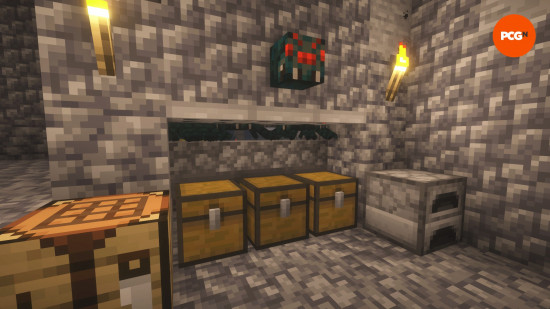 The entrance to a cave spider XP farm, showing chests and a swarm of spiders in one of the best Minecraft build ideas.