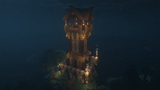 Best Minecraft tower designs: A tall medieval watchtower looms under a night sky.