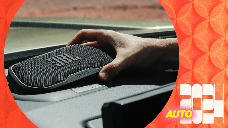  a hand removing a speaker from the dash