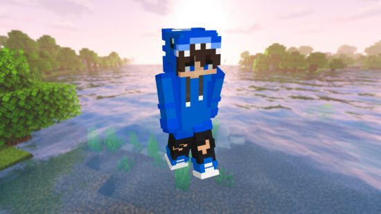 Best Minecraft skins: A Minecraft player stands int he snow in a blue hoodie skin, with the hood up.