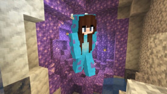 A girl in a blue and purple Sully Disney onesie Minecraft skin in front of a backdrop of an amethyst cluster.