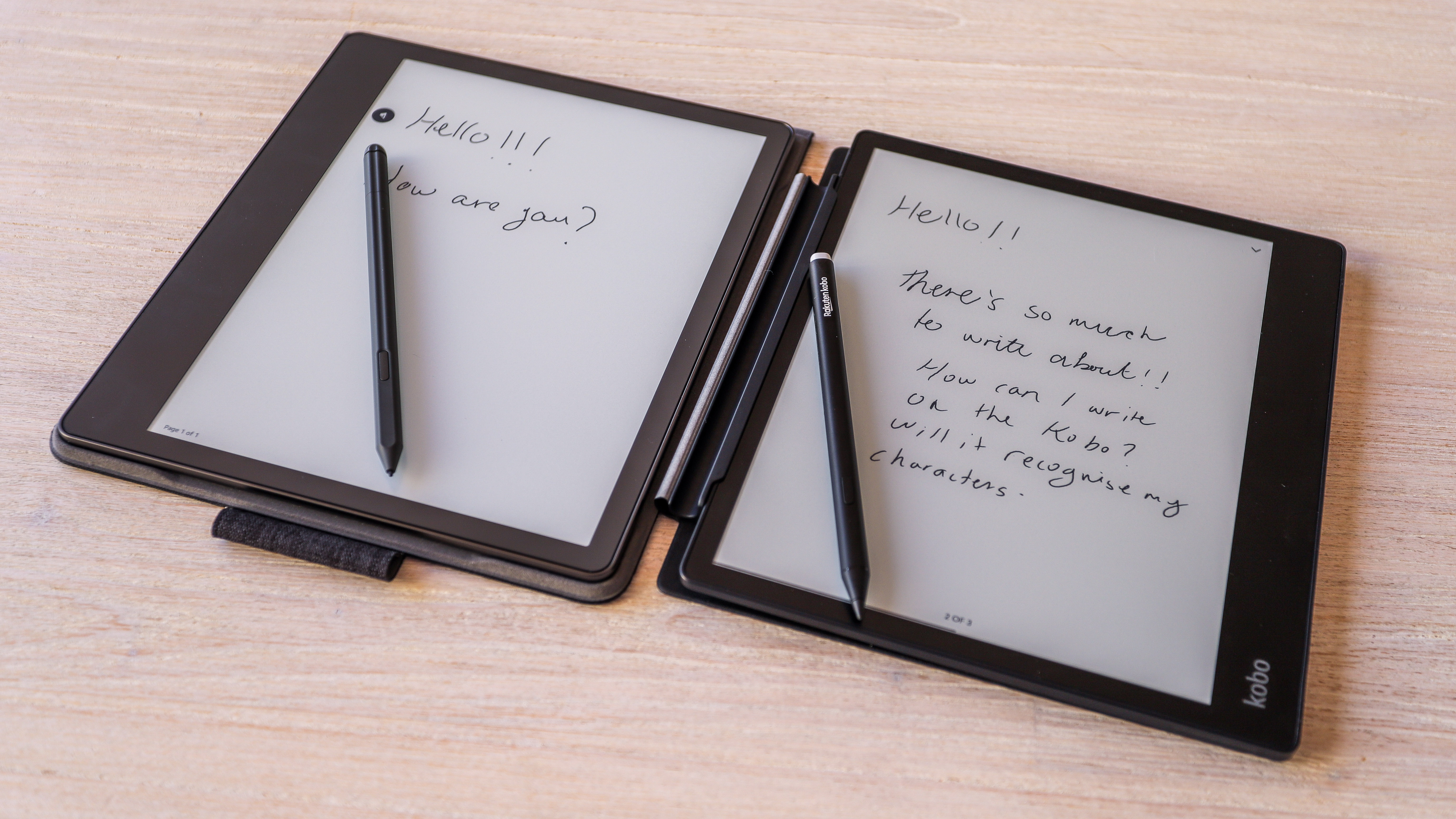 The Amazon Kindle Scribe (left) beside the Kobo Elipsa 2E (right) with their respective styluses