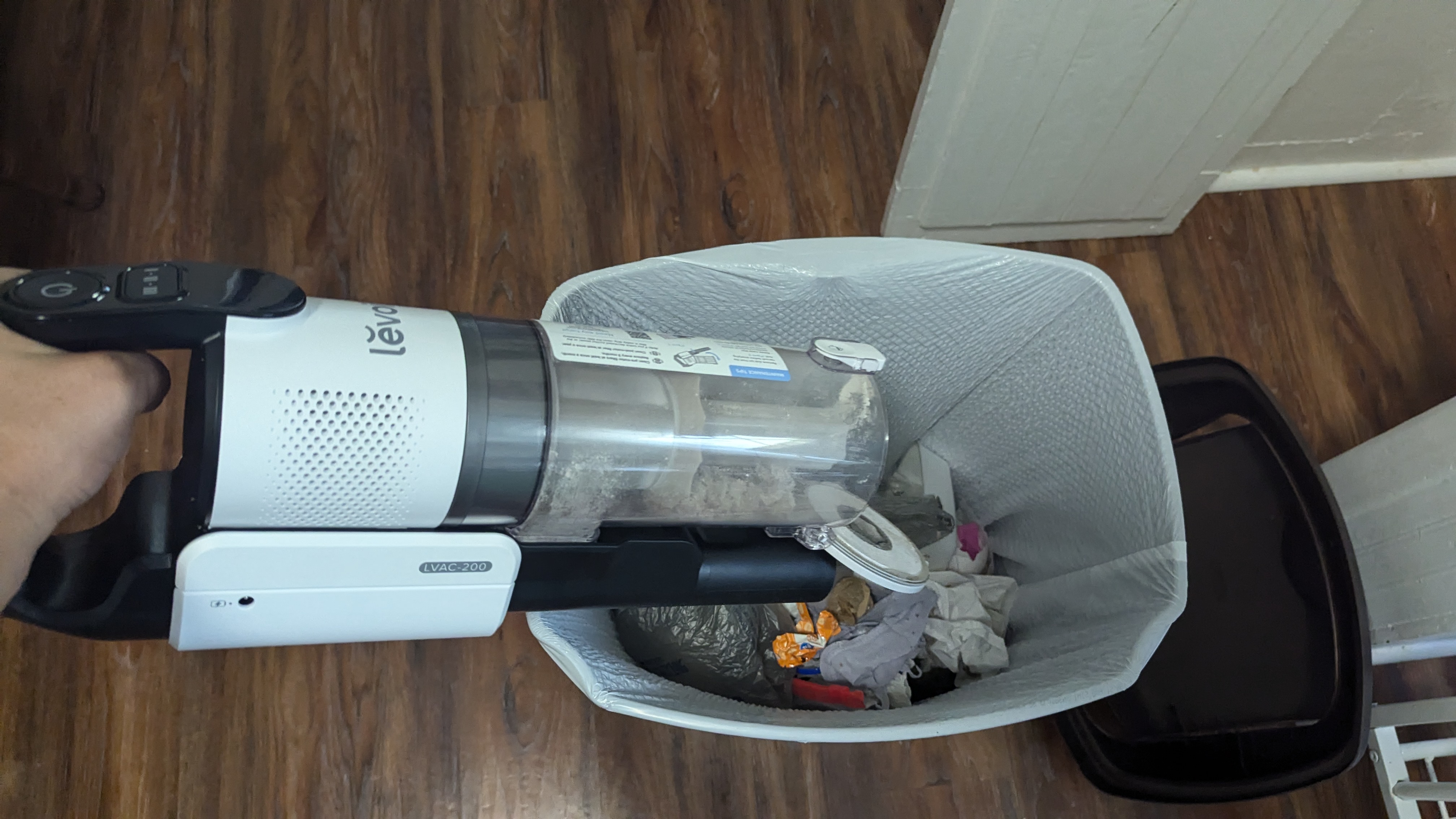 Emptying the bin on the Levoit LVAC-200 cordless vacuum